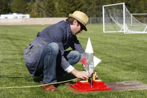 Science teacher John Baker with bottle rocket experiment Valemount Secondary mountain school