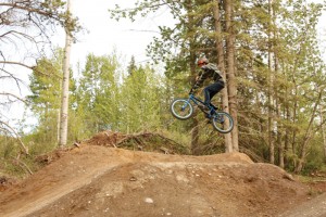 A mountain bike rider seen taking a jump at the Hinton Mountain Bike Park.