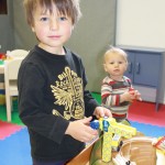 kinnickinnickers boy playing with toy