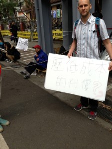  Johnathen says the sign they are holding is sarcastic, because if they were in China, they would not be able to openly protest like this, they would be hauled off the street and students would never have been allowed to take control of a legislative building for days straight. 