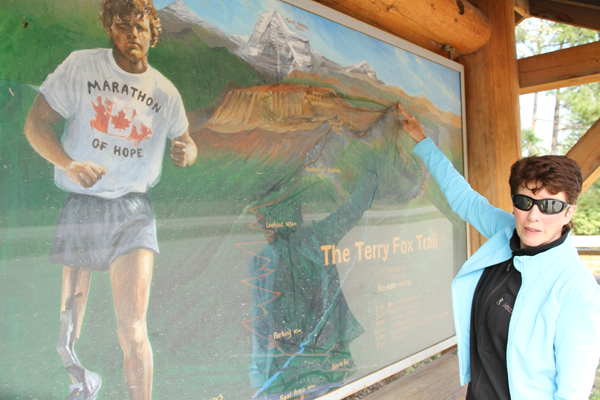 YORA President Patricia Thoni points to where the trail leads to the summit and monument. The hike is "a slog" she says, taking at least 12 hours to the peak.
