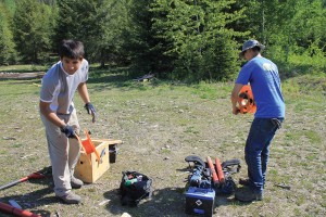 Students working with Professor Martyn Unsworth pack up the probes, wires and battery to move them to a nearby site for more testing.