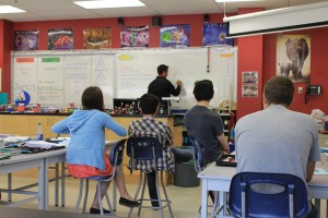 Craig Dunn, chief geologist with Borealis Geopower, describes to students at Valemount Secondary how the information they gather helps them map out the faults under us without drilling.