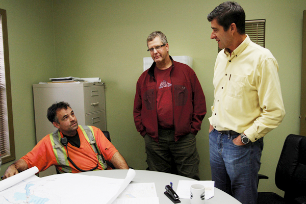 Rob Pepper chats with Jeff McWilliams (centre) and Wes Bieber (right) about the Community Forest’s tentative winter harvest plans at an open house last week.
