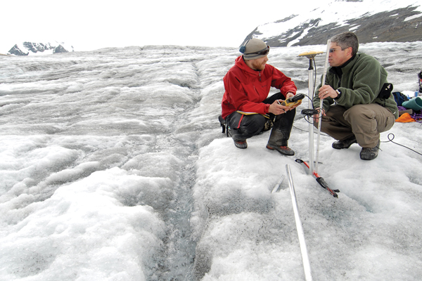 Photo courtesy UNBC The tip of the Castle Creek glacier near McBride has receded about 750 meters since research began 50 years ago. Castle Creek is unique in North America because it leaves behind rings that show the annual glacial retreat. Above: PhD student Matt Beedle (left) and professor Brian Menounos measure changes in glacier thickness using GPS.