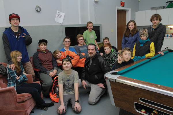 Some of the youth who frequent the V-Crew drop-in youth centre in Valemount, and youth coordinator Daren Sparks (centre)