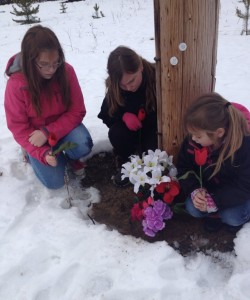 Duska's three daughters lay flowers near where their grandfather, missing since 2007, used to live.