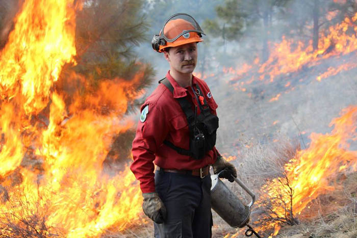 Photo courtesy BC Gov - A provincial firefighter doing a controlled burn.