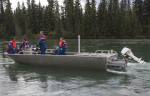 A Kinder Morgan spill response team motors out on the Fraser River in a jet boat to set up a decontamination unit. / EVAN MATTHEWS