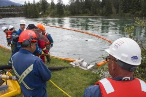A decon unit uses these orange booms, which are anchored in order to guide hydro carbon (oil), which floats. The booms have skirts sitting six to eight inches deep. / EVAN MATTHEWS