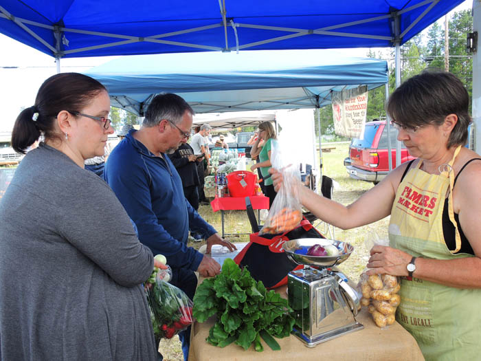Deb Cochrane, weighing her delicious vegetables
