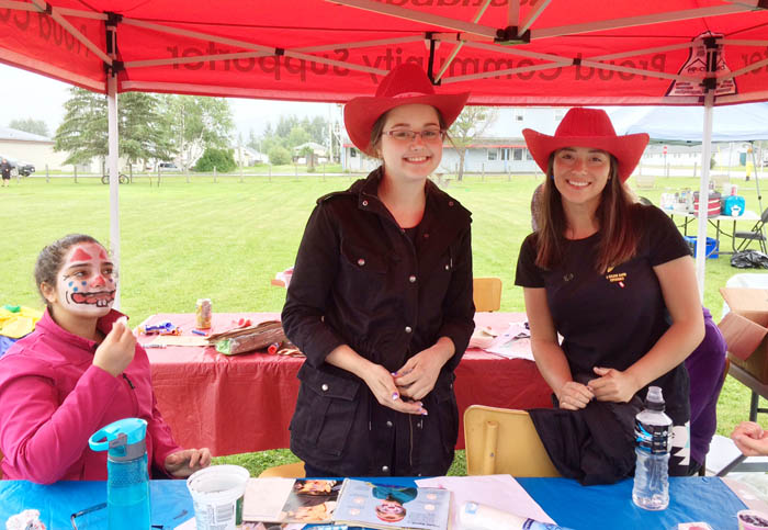 Hannah Day and Jasmine Vogel helped out the library with children’s facepainting and activities in Steve Kolida Park