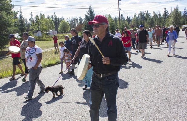 Photo: Evan Matthews Chief Nathan Matthew walks with his people toward Tête Jaune Cache.