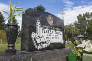 Photo: Evan Matthews The gravesite of Patricia Pooli's mother-in-law. The family wants the identical marker next to it for Robert Pooli, Patricia's father-in-law.