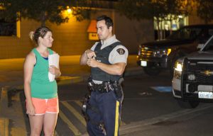 Photo: Evan Matthews Kim Duncan chats with Valemount RCMP, as the show of support was shut down.