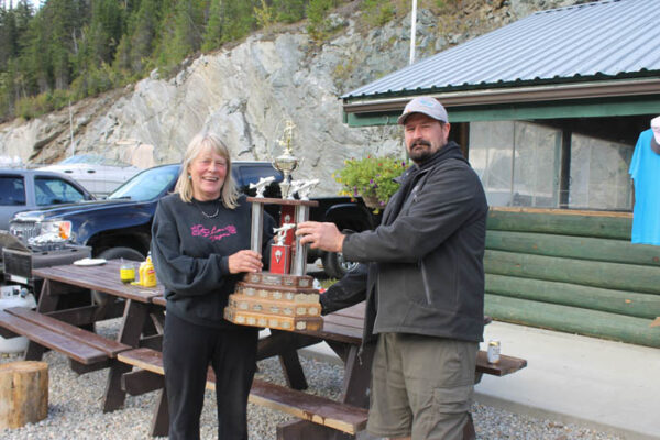  Lorna Griffin is presented her trophy for the Biggest Catch of the weekend by Marina Association president, Owen Torgersen, as she caught a rainbow weighing in at 4.07.