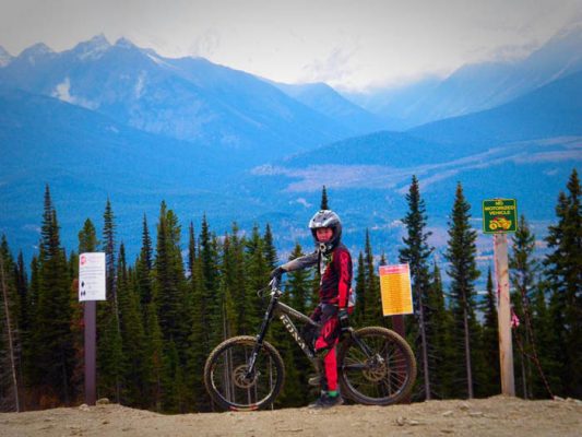 Photo: Alicia Hill Riley Hill poses for a photo before his first run down the new Downhill Trail.