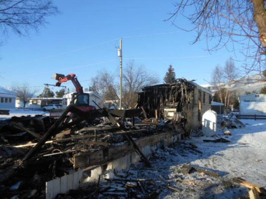 Photo: Darren Heaps After a tragic fire in Hartman Trailer Park claimed the life of 16-month-old Dominic Meek, the community has rallied together in order to support the Meek-Olson family. Regan Lewis is loading debris from the trailer into one of Bob Griffin’s dump trucks, seen below.