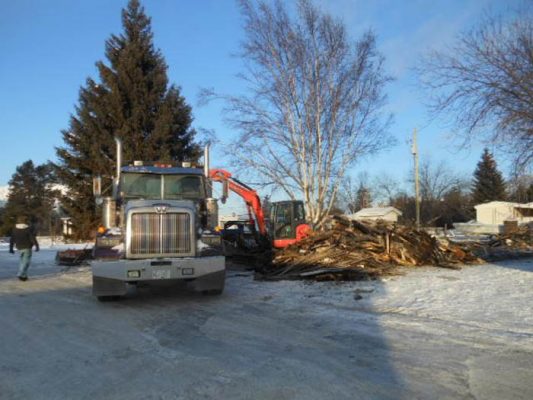 Photo: Darren Heaps Bob Griffin's dumptruck being loaded with debris.